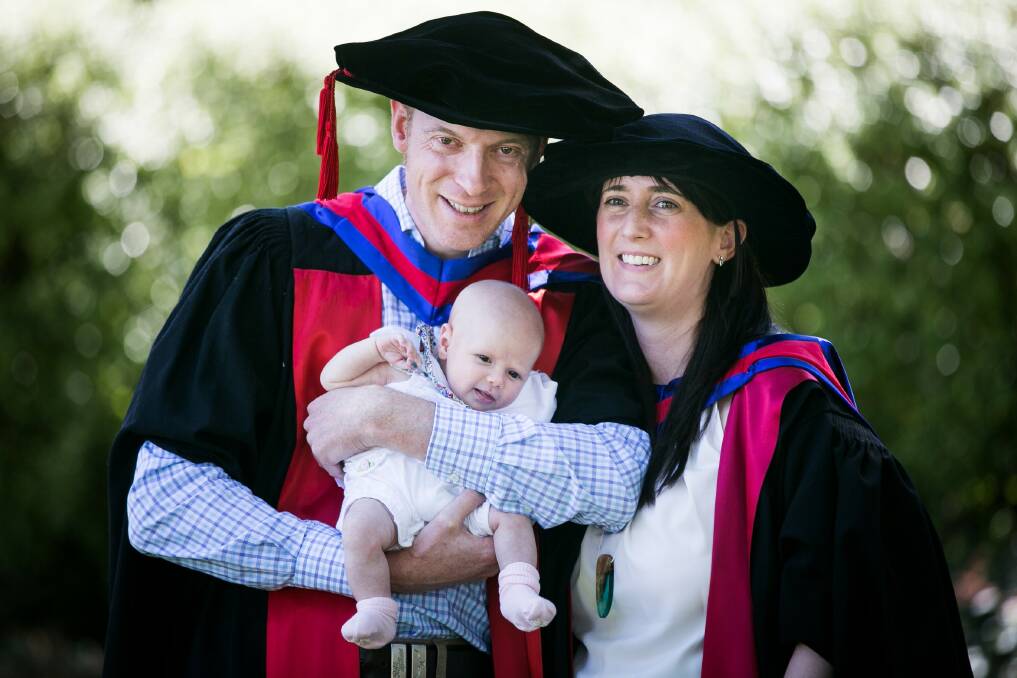 Jake Wallis and Kathryn Hopps both graduated with doctorate degrees this week in the presence of their seven-week old baby Erin Wallis.