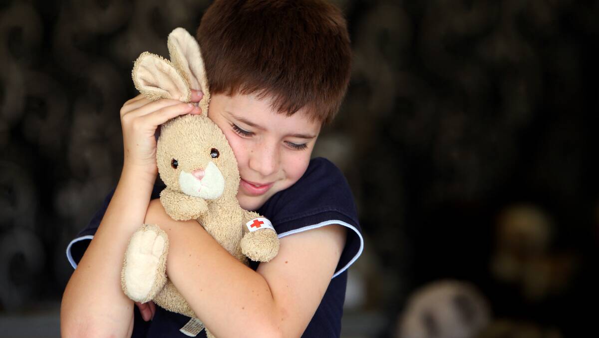 Albury's Pip Martinotti, 11, cuddles her beloved Rabby who was repaired at the Bear Hospital at Victoria's Gift Baskets. Picture: KYLIE ESLER