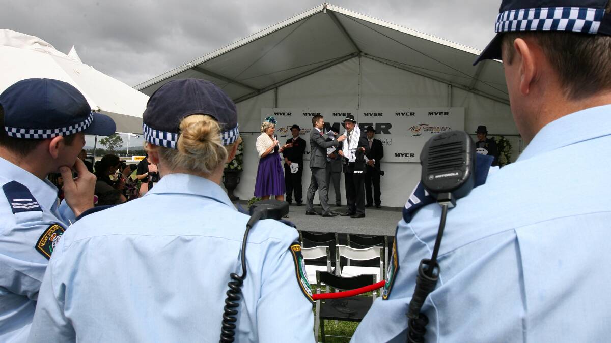 Albury police officerskeep an eye on the crowd through fashions on the field in 2012. 