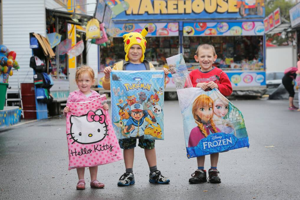 The Hanley siblings — Ella, 3, Rhys, 8, and James, 5, — from Lavington, were happy to get their hands on some show bags.