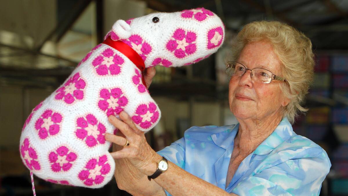 Cudgewa's Marlene Hamilton judging the crochet hippo that won its section.