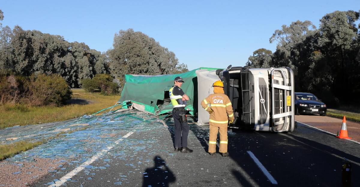 Emergency service crews were called to the scene to clean up the spill. Picture: PETER MERKESTEYN