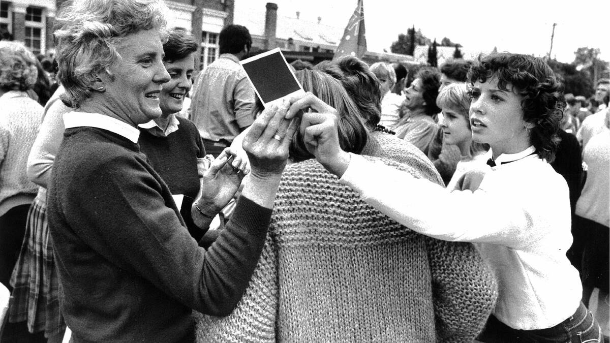 1983 - Prince Charles and Princess Diana make a royal visit to Albury. Heather Harrison from book Book, near Wagga, waited for two hours to see the Royals. She was rewarded by being able to get a close up pic of Princess Diana. She's pictured showing the photo to her daughter Cherie, 13. 