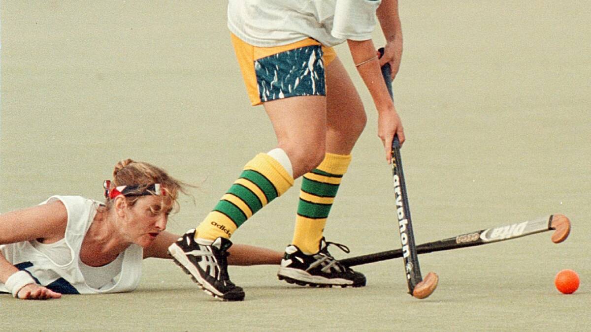 Kews' Sandy McGilvray tries anything to steal the ball from Hotboxes' Renee Trost at the Albury Hockey Centre Easter tournament. Picture: CHRIS McCORMACK