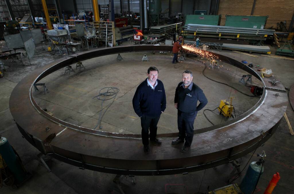 Project manager Ross Tuckwell and managing director Andrew Kotzur with part of a silo which are being made for grain terminals. Picture: DAVID THORPE
