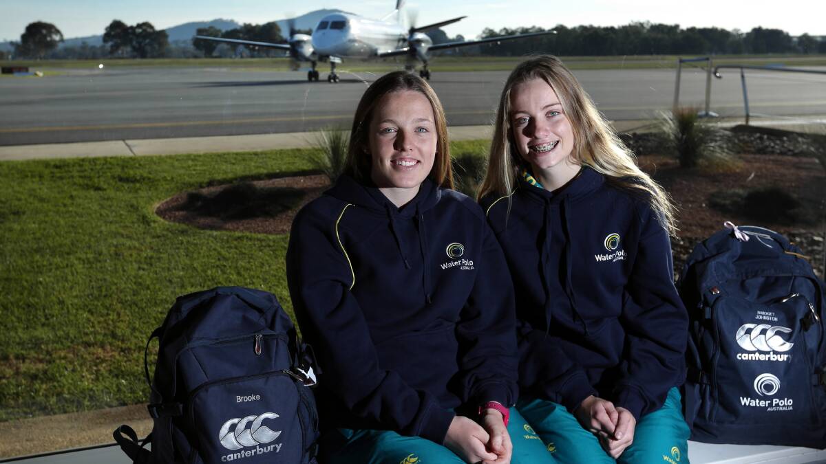 EUROPE BOUND: Australian water polo players Brooke Dickie, 17, and Bridget Johnston, 16, yesterday headed to Europe with the national under-18s team. Picture: MATTHEW SMITHWICK