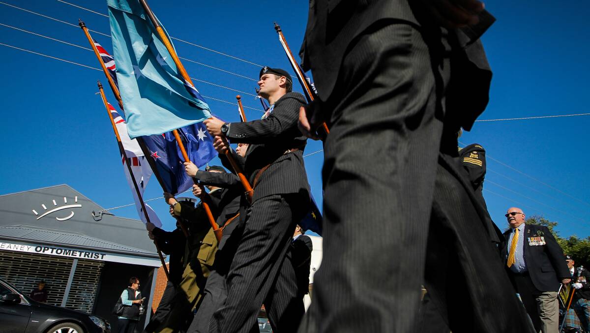 Army flag bearer Tim Thompson leading the march in Yarrawonga. Picture: DYLAN ROBINSON