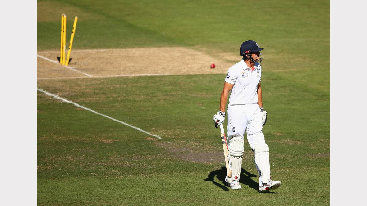 Alastair Cook of England walks from the ground after he was bowled by Mitchell Johnson. Picture: GETTY IMAGES