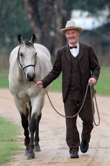 Geoffrey Graham leads Cherry the horse as he plays the character of Banjo Paterson. Pictures: KYLIE ESLER