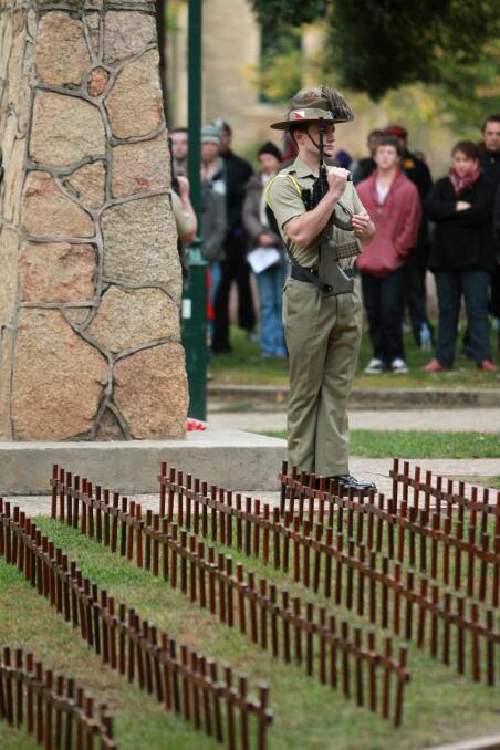 Hundreds of crosses bearing the names of fallen soldiers were placed near the cenotaph for the Anzac Day ceremony at Beechworth. Picture: MATTHEW SMITHWICK