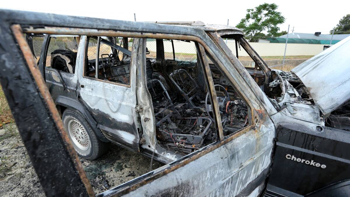 A burnt-out Jeep Cherokee at the back of a factory in Calimo St, North Albury. Picture: MATTHEW SMITHWICK
