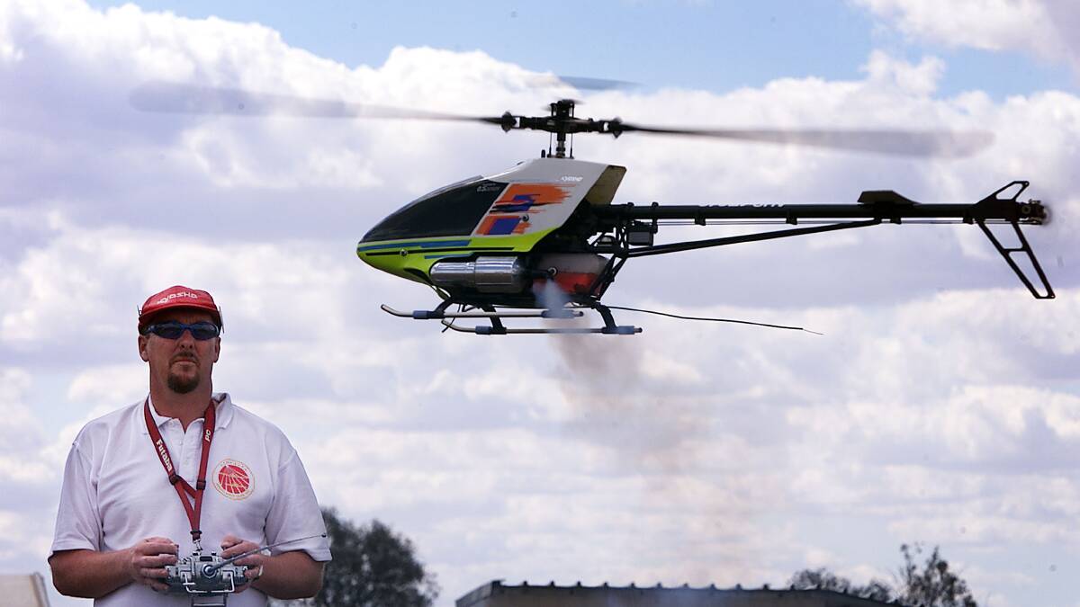 Mick Warren from Brisbane at the controls of his model helicopter. Mick is rated third in the national model aero club championships in the F3C expert class.Picture: MATTHEW SMITHWICK