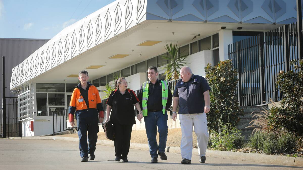 DSI employees Terry Meredith and Marilyn McMillan leave after the meeting with AMWU National Assistant Secretary of the Vehicle Division Warren Butler and Regional Secretary of the NSW Vehicle Division Sean Morgan. Picture: TARA GOONAN