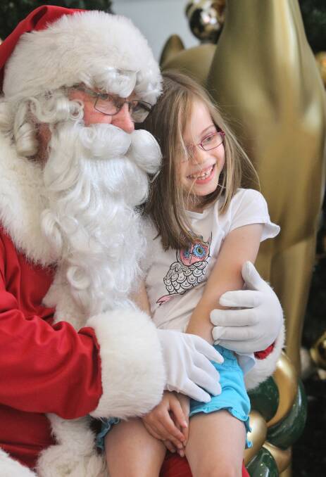 Baranduda's Josie Grealy, 6, was delighted to have a giant cuddle with Santa.