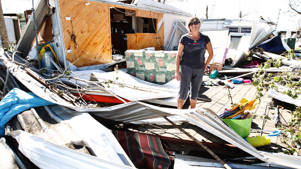 Michelle Thomas stands among the wreckage at the Denison County Caravan Park. Picture: BEN EYLES