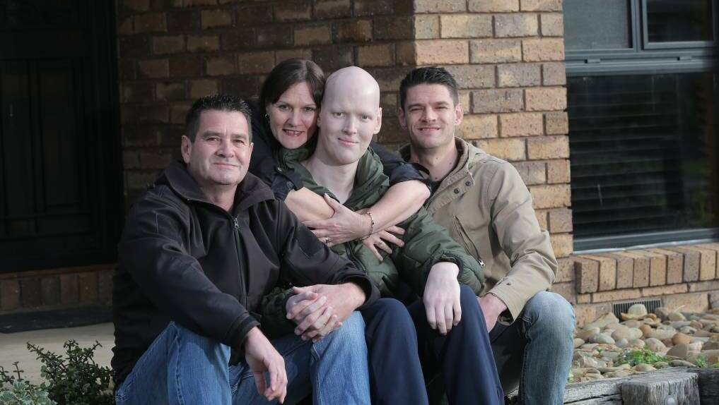 Aaron Lyon with his dad Alan, mum Andrea and brother Aiden.
