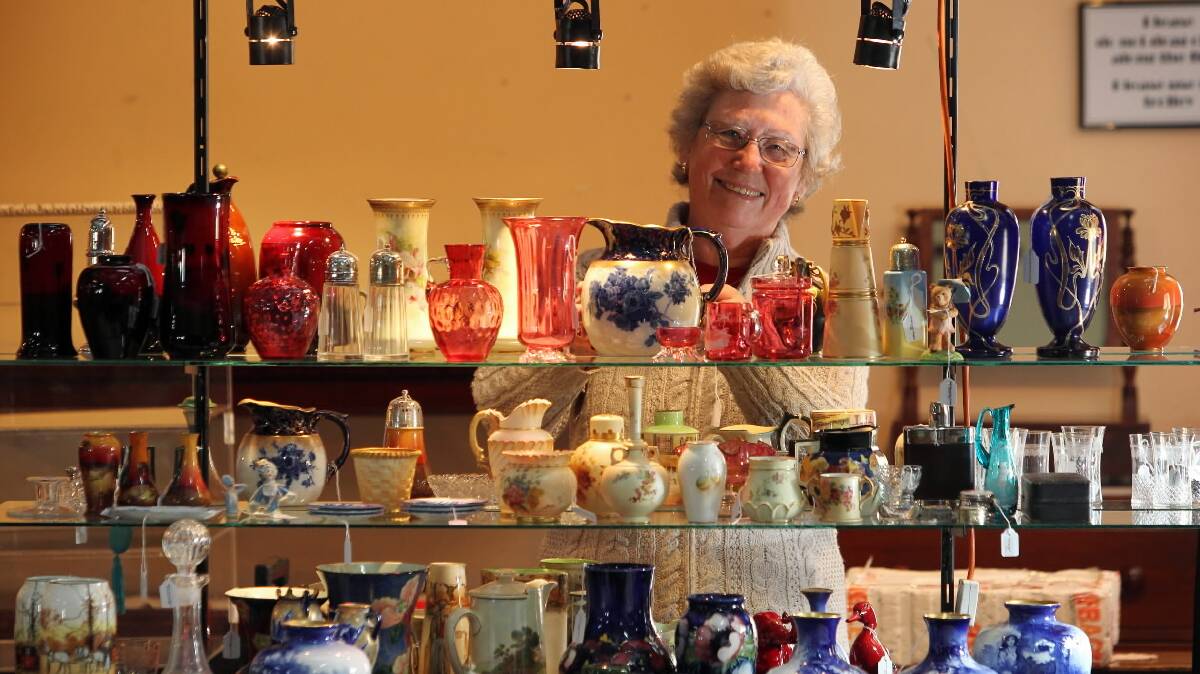 Pat Morrison, of Morrison Antiques, Tumut, prepares her stall for the weekend's Chiltern Antique Fair. Picture: DAVID THORPE