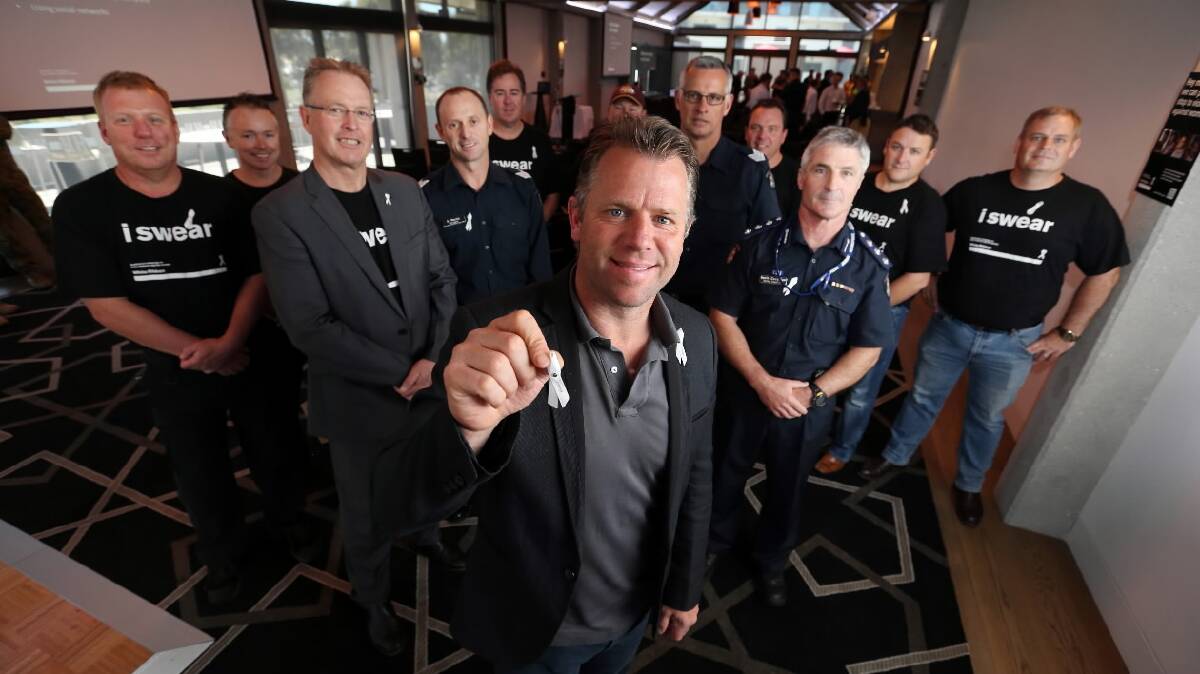 Former AFL footballer Glenn Archer  flanked by Cr Mark Byatt, Sgt Shane Martin, Sgt John Huntington, Acting Inspector Kevin Coughlan, and members of the Wodonga Apex Club, during a White Ribbon Day event at the Huon Hill Tavern. Picture: MATTHEW SMITHWICK