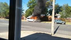 The  van is engulfed by flames.
