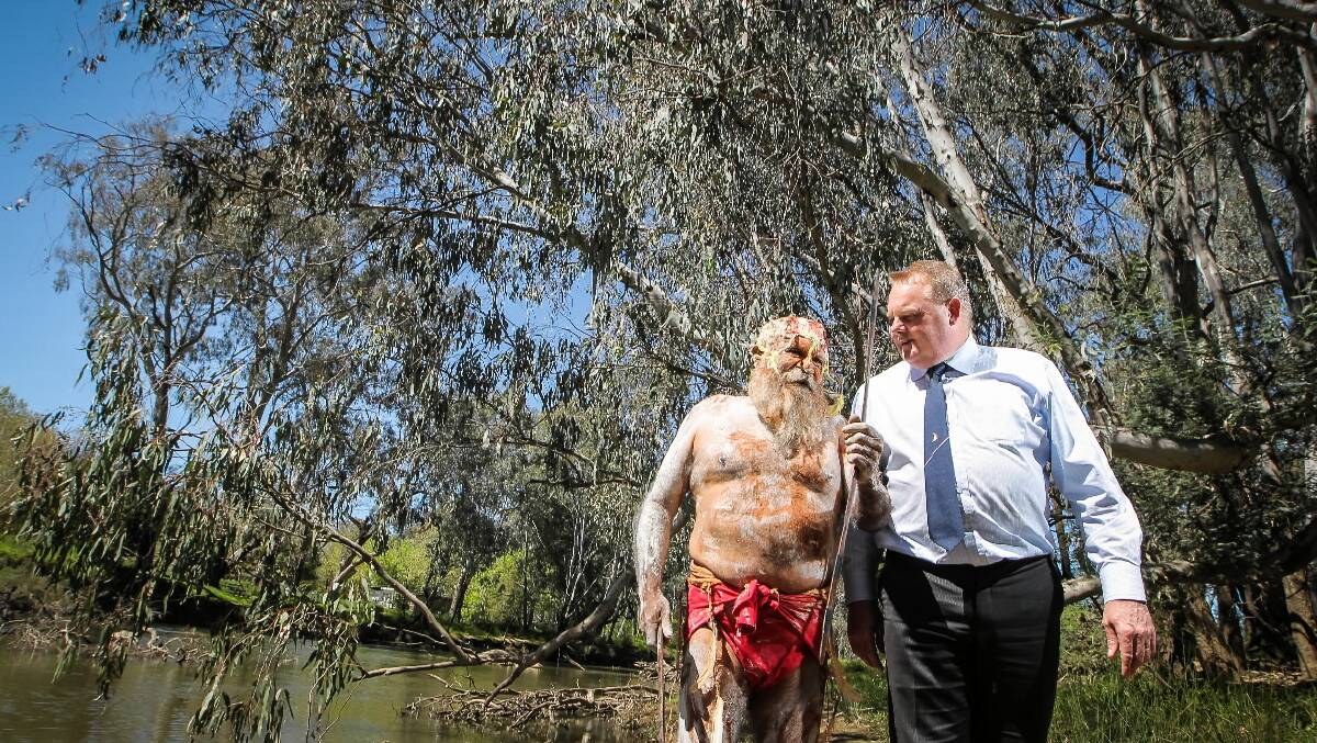 Minister for Local Government and the Minister for Aboriginal Affairs Tim Bull makes an announcement regarding walking trails. Pictured with aboriginal elder Uncle Robert (Wally) Cooper. Picture: DYLAN ROBINSON