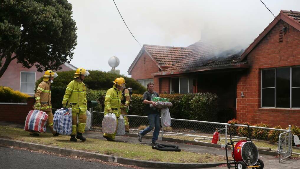 House fire on Ocean Grove, Warrnambool. Family and fire crew were able to rescue the family's Christmas presents from the burning fire undamaged. Picture: Amy Paton
