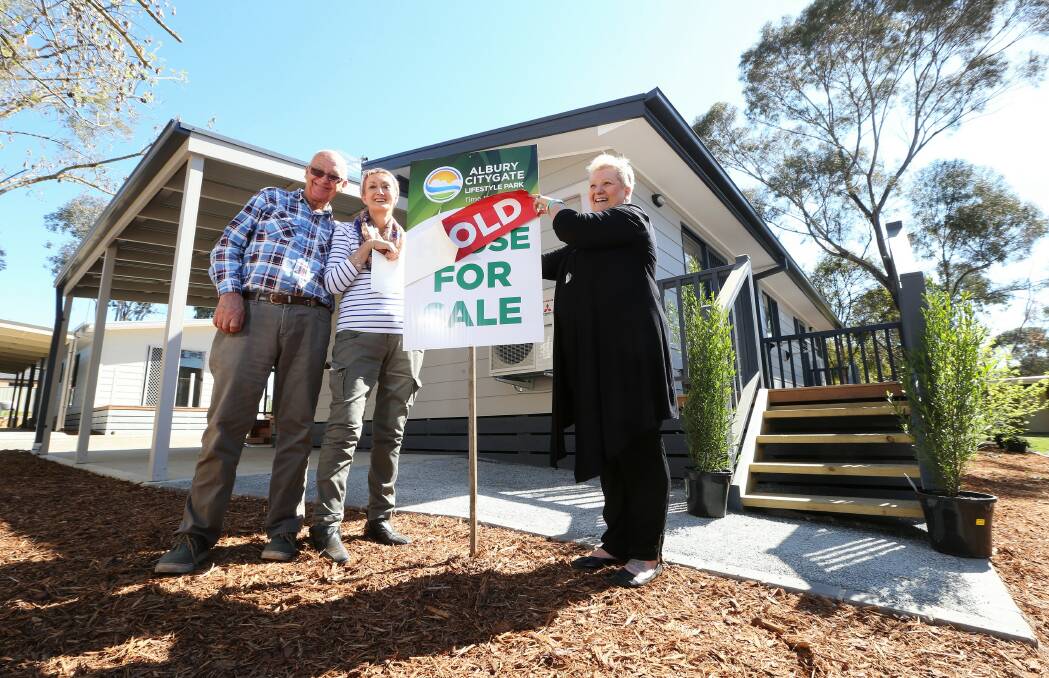 Graeme and Heather Smith together with Janet Lauritzen in front of their new house at Albury Citygate Lifestyle Park. Picture: JOHN RUSSELL