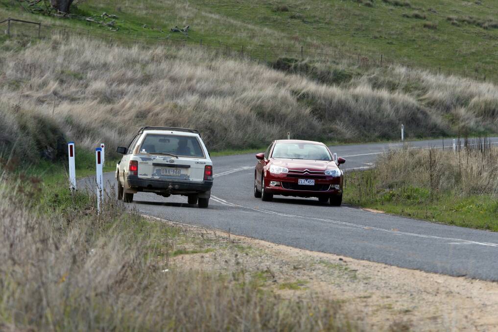 Two cars passing on a narrow section of the Riverina Highway. Picture: PETER MERKESTEYN
