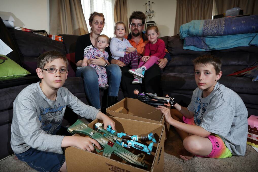 Brenda and Daniel Whichelo with children Hunter, 9, Evie, 16 months, twins Abbie and Indie, 4, and Healy, 11, in the midst of packing up their rented home. The family does not know where they will go. Picture: MATTHEW SMITHWICK
