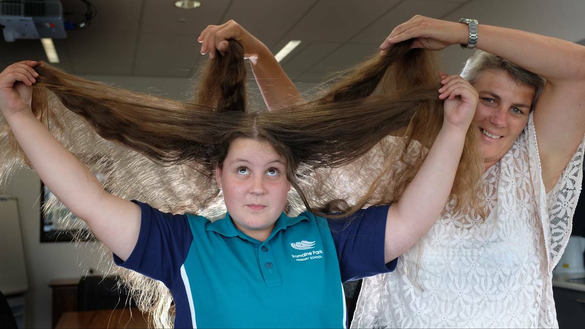HAIR-RAISING: Romaine Park Primary pupil Jessica Williams and school business manager Aleta Radford are ready to lose their locks in support of the Leukaemia Foundation's World's Greatest Shave. Picture: Grant Wells. - The Advocate