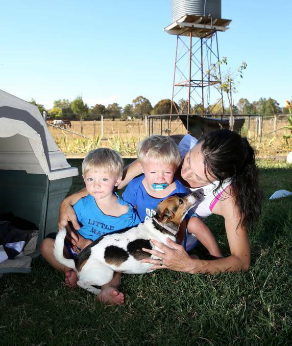 Mother Tracey Barnett with her twins Blake and Tyler, and pet dog Rosie. – Photo:Matt Bedofrd, the Armidale Express