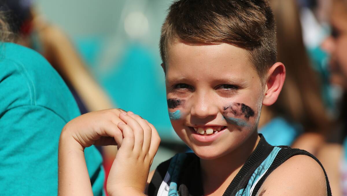 A young Power supporter looks on during the round two AFL match between the Port Adelaide Power and the Adelaide Crows at the Adelaide Oval. Photos: Getty