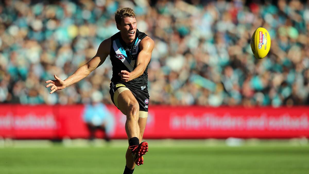 Brad Ebert of the Power kicks the ball during the round two AFL match between the Port Adelaide Power and the Adelaide Crows at Adelaide Oval on March 29, 2014. Photos: Getty