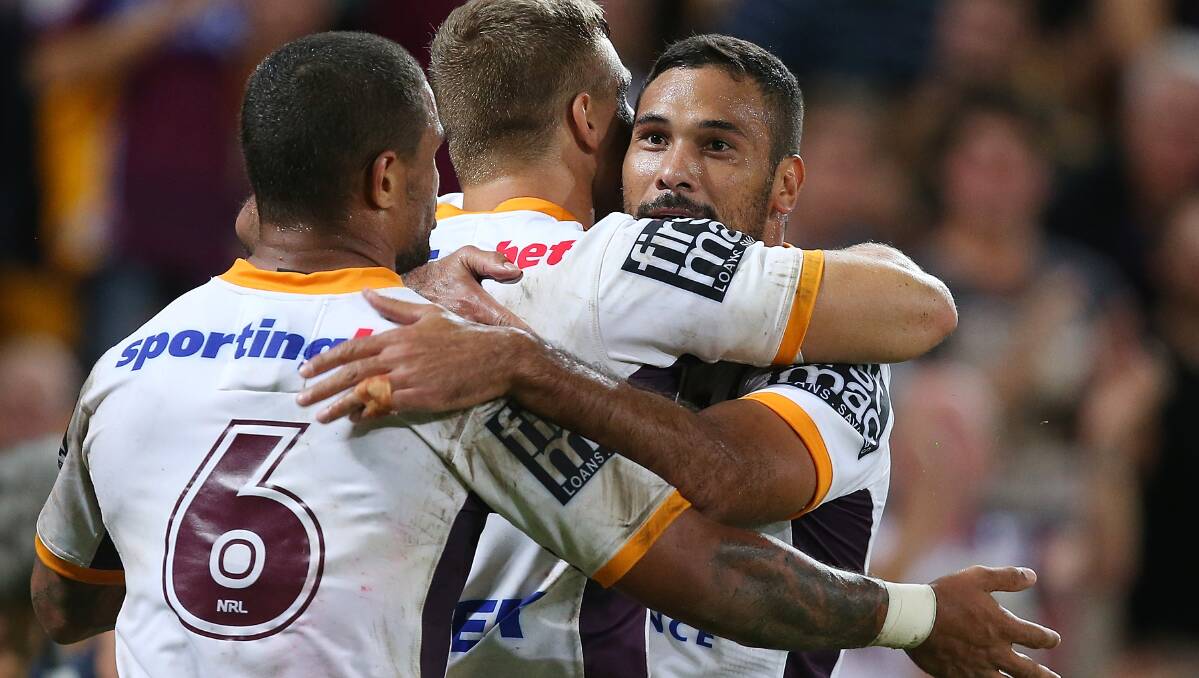  Dale Copley of the Broncos celebrates with team mates Josh Hoffman and Justin Hodges and scoring a try. The Eels defeated the Broncos 25-18 on Brisbane turf in Round Five of the NRL. Picture: Getty Images