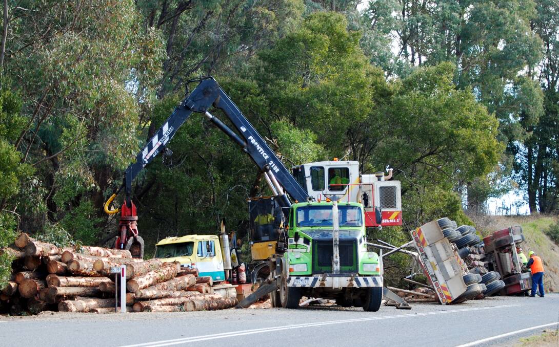 ROLLED: A Greenfreight logging truck rolled at Koetong on July 8 last year in one of several serious crashes involving the Wodonga business. 
