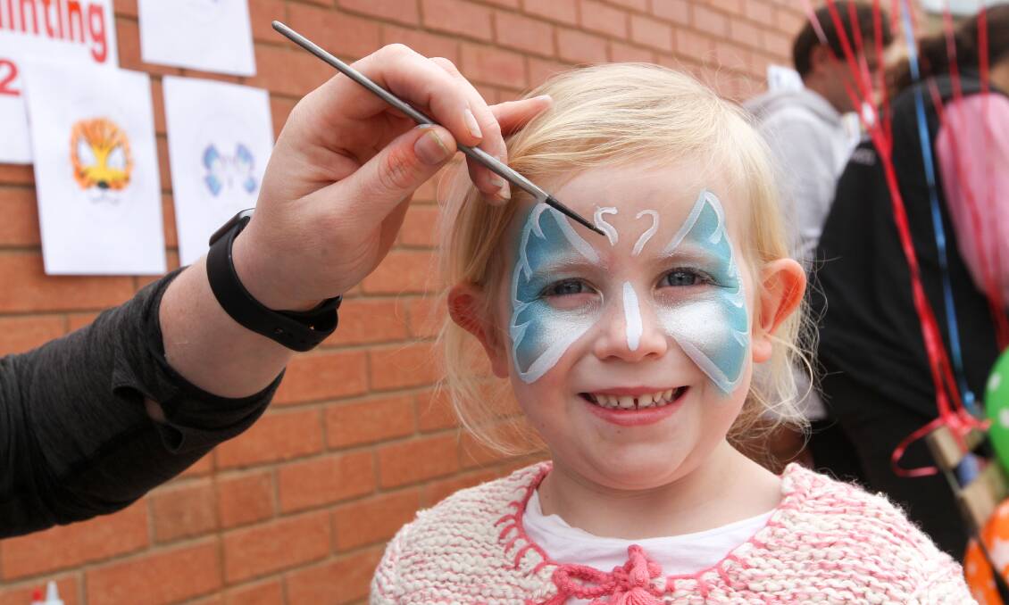PAINTING: Ava Ryan has her face painted. It was one of several activities at the event to raise funds for the four children. 