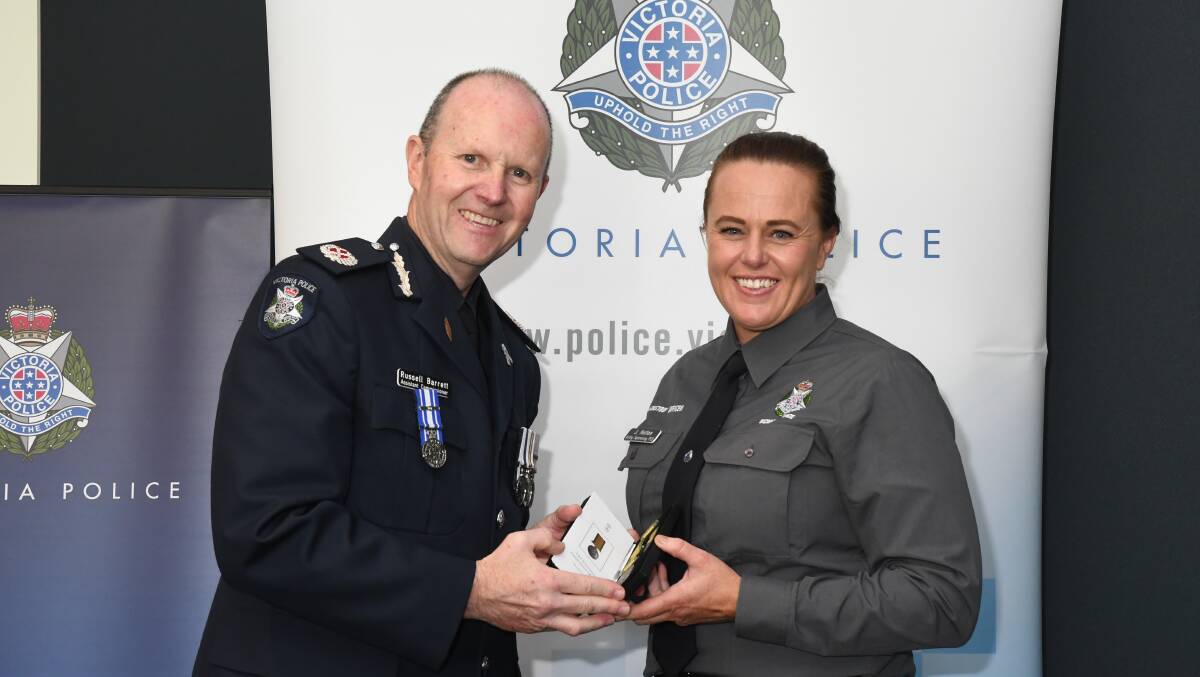 Assistant Commissioner Barrett commends custody officer Jacinta Hutton for her work during the Black Summer fires. Picture supplied