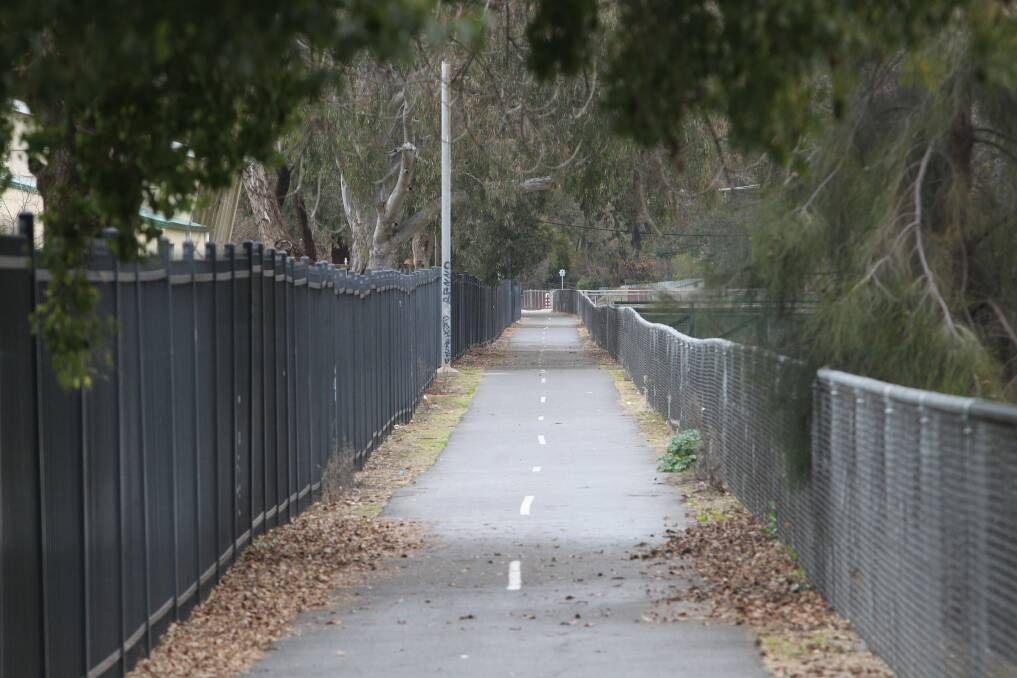 CRIME SCENE: The woman was assaulted on a bike path next to the Bungambrawatha Creek, near Albury High School, on Saturday. The man is described as 50 to 70, about 180cm tall with a skinny and fit build. He had dry, cracked hands, and was wearing a plain black fine-knit wool beanie, navy blue jacket, long dark plants and black, chunky watch. 