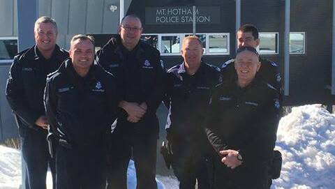 MEETING: Police, including the state's top officer Chief Commissioner Graham Ashton, at the Mt Hotham station on Wednesday. 