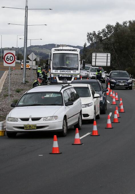 TESTING TIMES: Police at a drug and alcohol site on the Bandiana Link. They conducted about 1500 tests on drivers over the four day operation. Picture: JAMES WILTSHIRE