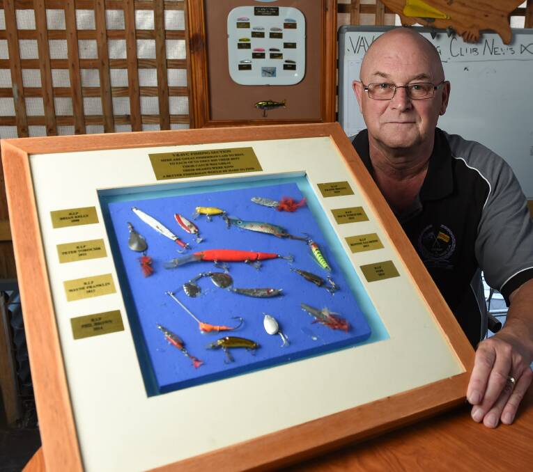 HONOUR: Scotty Coupar with a North East fishing club memorial board which will soon bear Mr Miosge's name. 