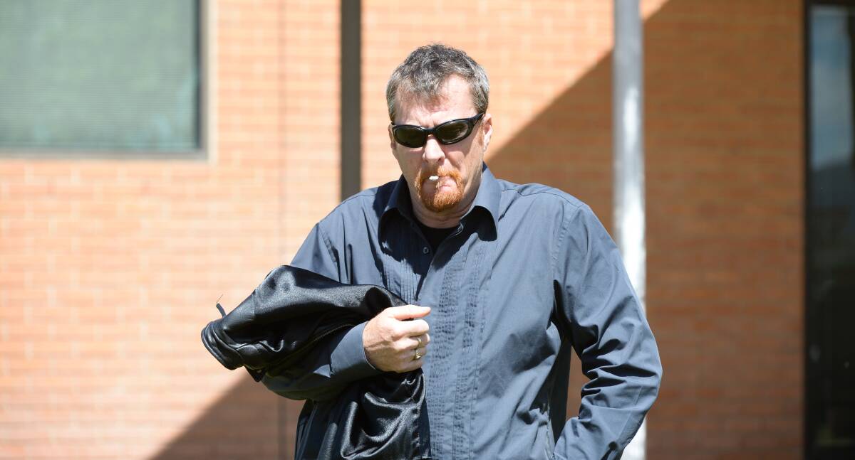 AGGRESSIVE: Jack McLean's father, Wayne, walks up to the media outside Wodonga Court on Wednesday