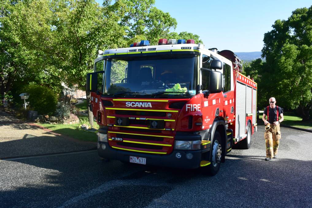 RESPONSE: Firefighters outside a home in Wodonga on Thursday after an evaporative cooling system caught alight. Picture: BLAIR THOMSON