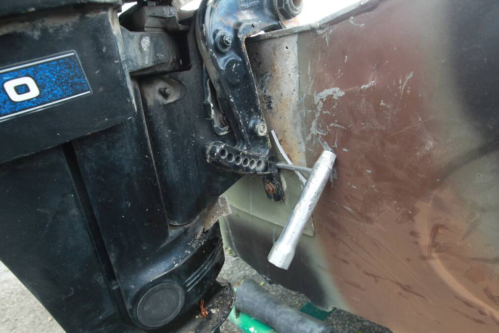 FOILED: The man tried to pry this motor off the boat but failed