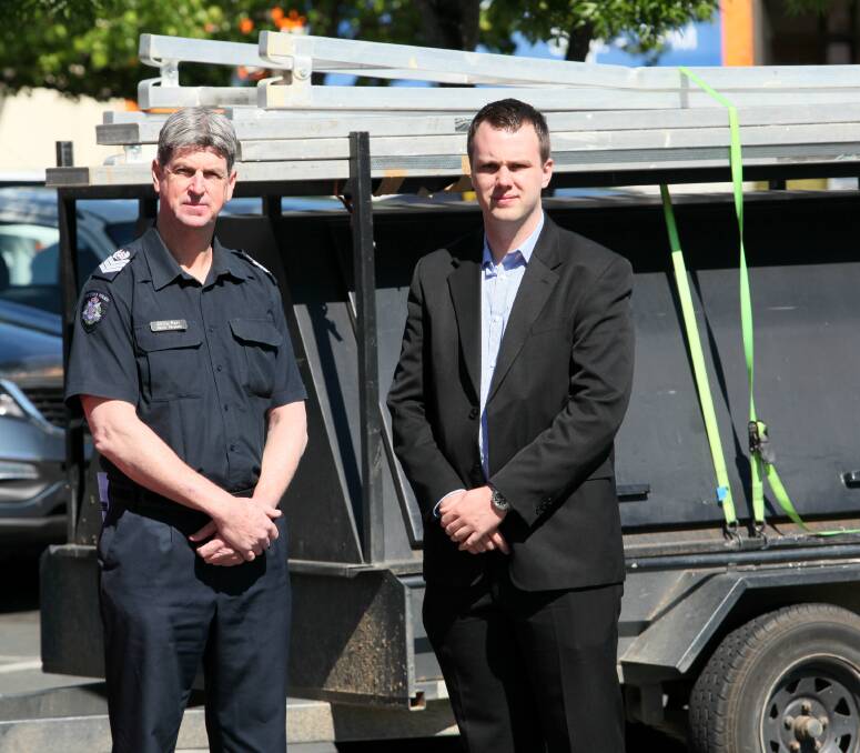 LOCK UP: Senior Sergeant Chris Parr and Crime Stoppers communications coordinator Chris Plumridge are urging people to take steps to secure their property to deter thieves. Picture: BLAIR THOMSON