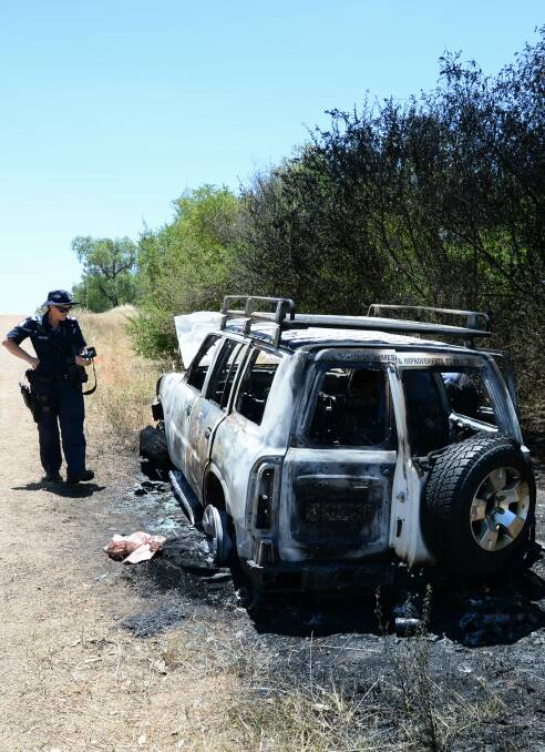 DUMPED: The torched vehicle, which had been towing the trailer