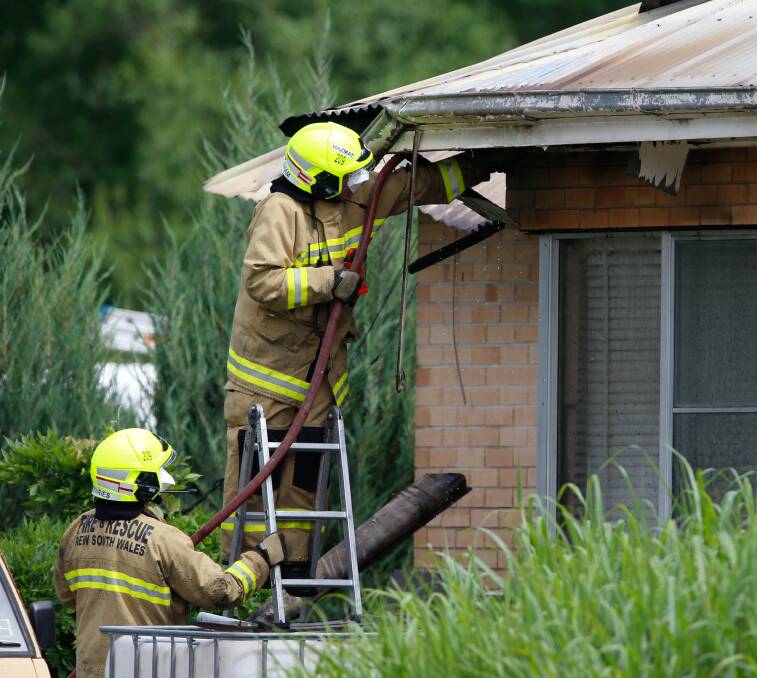 INVESTIGATION: Firefighters examine the home Mr Miosge had been living in. Picture: MARK JESSER