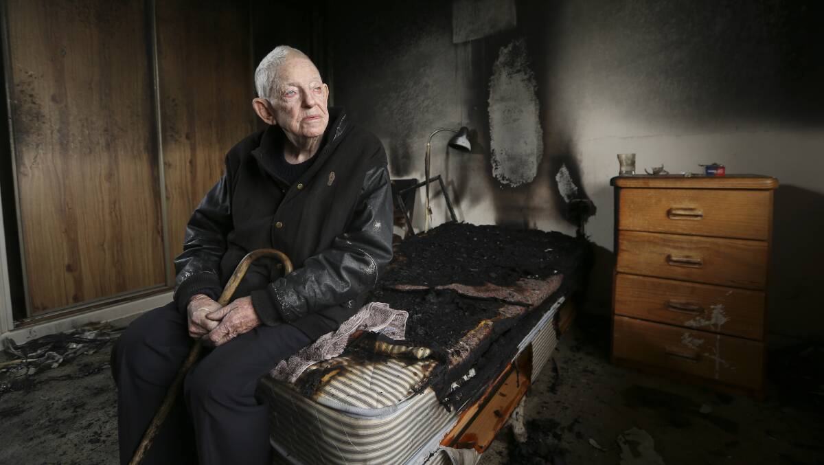 LOOKING ON BRIGHT SIDE: Frank Bensted, 85, inside his damaged Wyse Street unit on Thursday. Picture: ELENOR TEDENBORG
