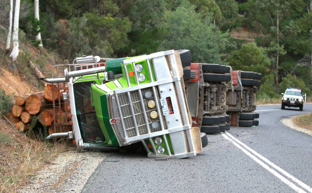 TIPPED: A Greenfreight logging truck rolled on the Walwa-Jingellic Road, about two kilometres north of the Murray Valley Highway, on May 3. The company faced court in Wodonga last week. 