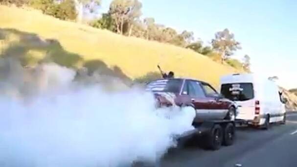 Hume skid hoons in cop sights following burnouts on moving trailer