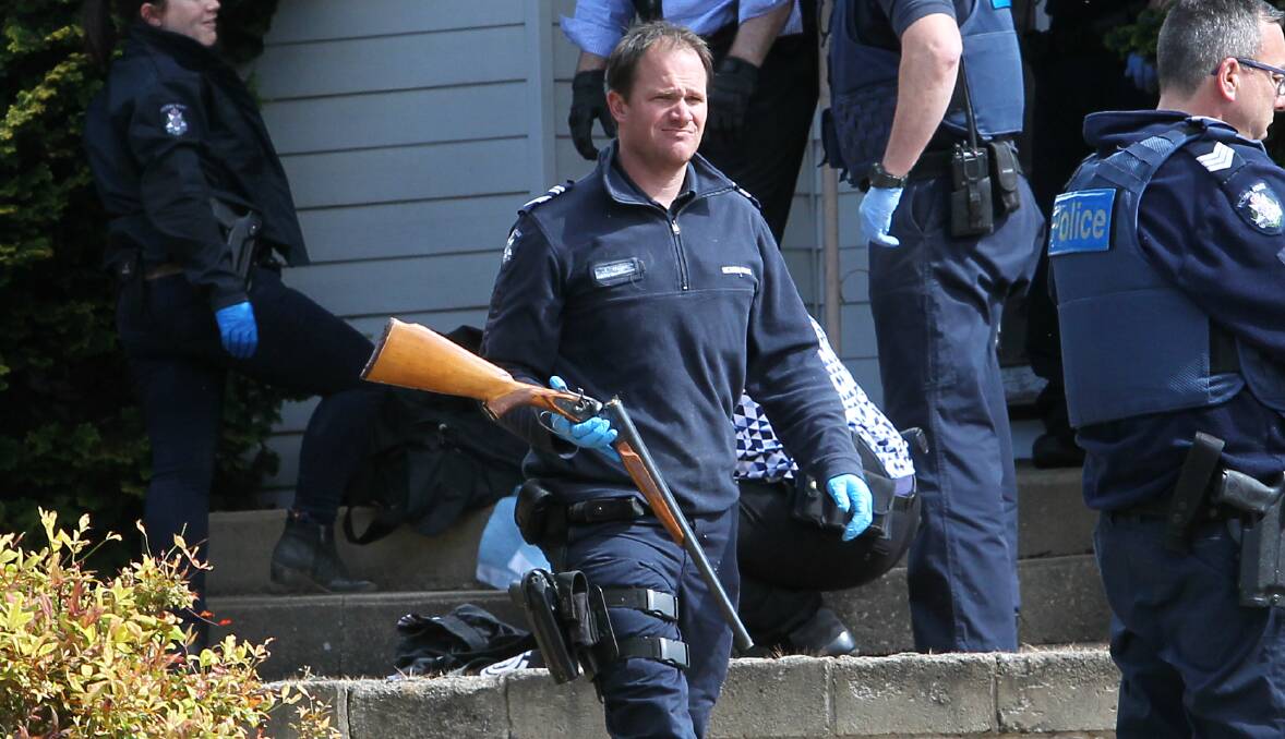 THREATS: Officers recover a shotgun from a home on the Kiewa Valley Highway in October. The serial number was ground off and the gun was believed to be stolen. Kade Bartel had threatened to shoot his mother with the weapon. 